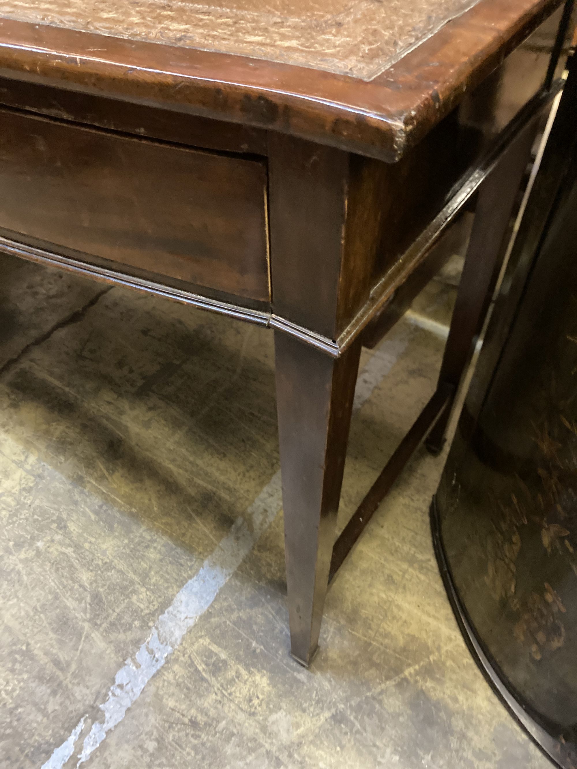 A George III style mahogany bow front writing table, width 123cm, depth 50cm, 74cm